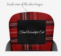 a plaid seat cover with the words view of the shoe tongue